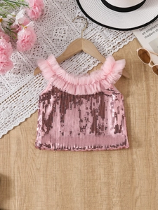 Girls pink sequin tank top with tulle ruffle trim on a wooden hanger with summer accessories