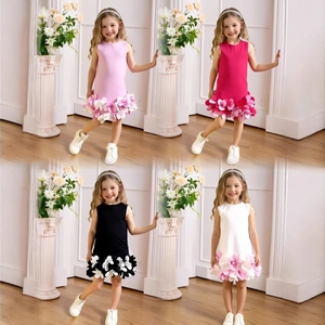 Detail view of sleeveless girls' princess dresses with layered floral petal skirts in four colors