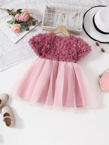 Pink girls party dress featuring 3D floral bodice and layered tulle tutu skirt