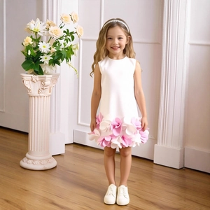 Detail of white sleeveless dress with dense 3D pink and white layered flower petals