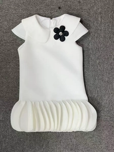 Girl's white bubble-sleeve dress with Peter Pan collar and black floral detail