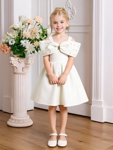 Elegant white satin flower girl dress with off-shoulder bow detail and full pleated skirt