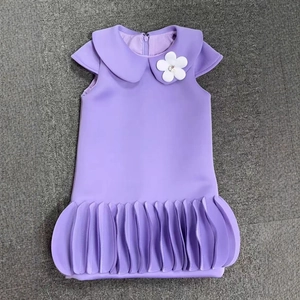 Detail of lavender dress featuring Peter Pan collar and 3D floral decoration