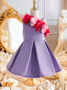 Detail of 3D floral accents on a lilac girl's sleeveless party dress on a mannequin