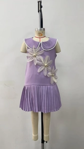 Detail of purple sleeveless girl dress with 3D white mesh flowers and lace collar