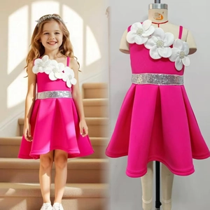 Detail of girls' one-shoulder fuchsia party dress with white 3D flowers and sequined belt