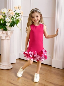 Sleeveless girls party dress in magenta featuring 3D floral appliques and layered skirt