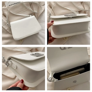 Vue détaillée du sac blanc montrant la texture du cuir, le fermoir et l'espace intérieur