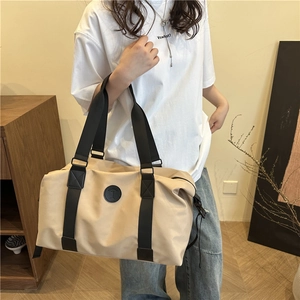 Minimalist beige nylon gym bag with large capacity and black straps for women