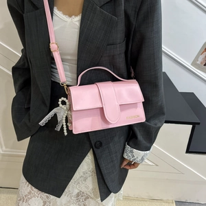 Pink PU leather crossbody bag with pearl bow charm and fashion gold lettering