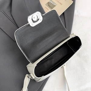 Top view of cream white PU leather handbag showing interior space and silver twist lock