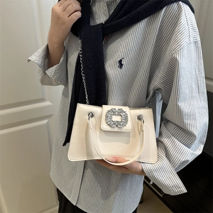 White leather handbag with shimmering crystal square buckle and silver chain strap