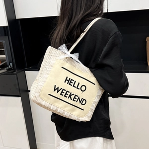 Fashionable beige woven tote bag with Hello Weekend print and lace bow details for women
