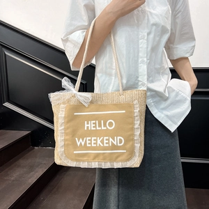 Summer woven tote bag with Hello Weekend print and lace bow for vacation style