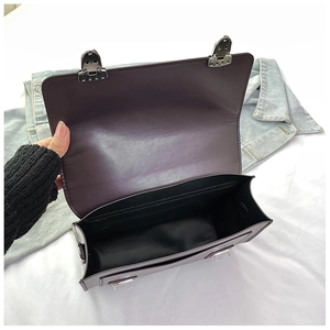 Macro view showing the large capacity main compartment of this vintage messenger bag