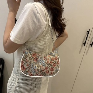 Floral jacquard shoulder bag with silver chain strap and metallic bow decoration