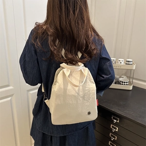 Versatile off-white lightweight nylon backpack for women with dual top handles