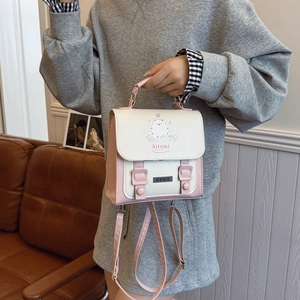Pink and beige college style backpack with cute cat illustration and handle