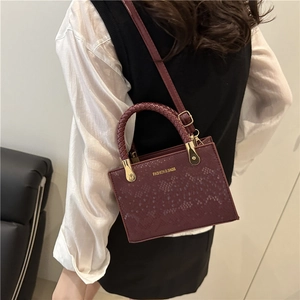 Burgundy square crossbody bag with snake-skin texture and woven handle for women