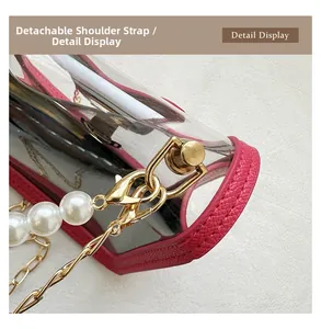 Detail view of transparent PVC bag with rose pink leather trim and golden pearl chain