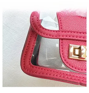 Detailed close-up of pink litchi grain leather stitching and gold metal turn-lock buckle