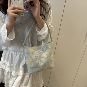 Sac seau bleu clair en toile à fleurs jaunes avec poignée supérieure pour femme