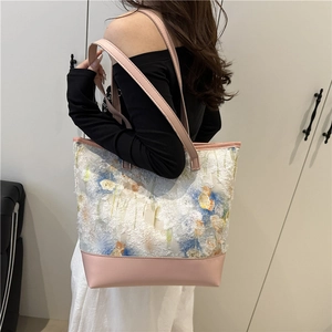 Floral canvas tote bag with fringe texture and pink straps for casual daily use