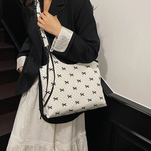 Women's pleated tote bag with bow print and black drawstring for casual summer fashion