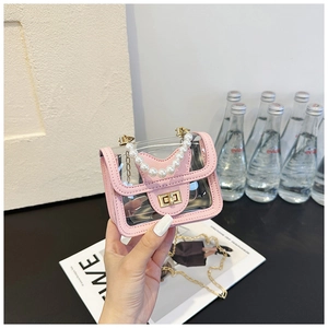 Close-up of pink transparent crossbody bag with pearl handle and golden chain strap