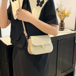Straw woven saddle bag with floral embroidery and gold clasp for summer style