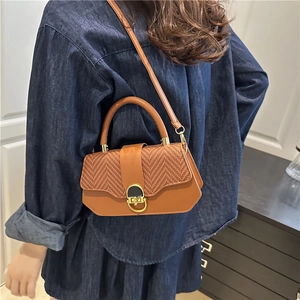 Brown faux leather and straw woven crossbody bag with gold lock and top handle