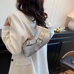 Silver metallic crescent hobo bag with Y2K belt detail and studs for casual outfits