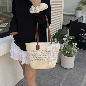 Chic beige woven tote bag with hollow mesh design and elegant white lace bow detail