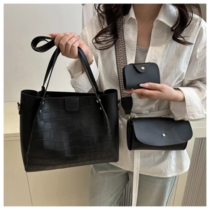 Close-up of black 3-piece bag set with tote, crossbody bag, and card holder