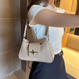 Minimalist beige leather underarm bag with silver star buckle and slim shoulder strap