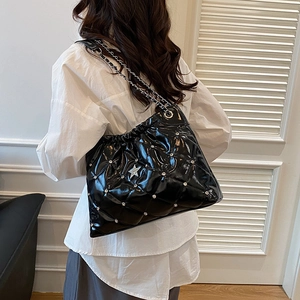 Quilted black patent leather tote bag with star rhinestones and silver chain strap