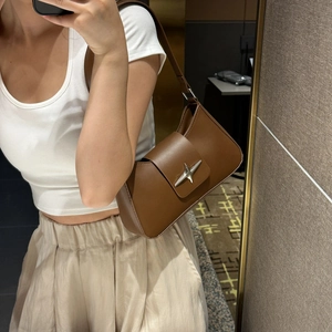 Deep brown faux leather underarm bag with silver star buckle in a stylish mirror selfie
