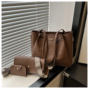 Three-piece brown coffee tote set featuring embossed stone texture and woven strap details