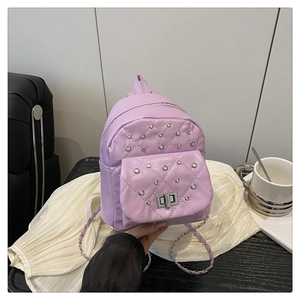 Detail of lavender quilted PU leather backpack with rhinestones and metal chain strap