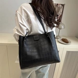 Black crocodile embossed tote bag with dual shoulder straps for stylish daily commute