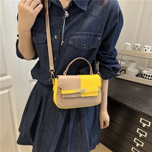 Fashionable color-block handbag in khaki and yellow with gold buckle and crossbody strap