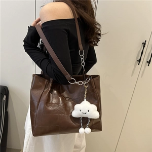 Large brown PU leather tote bag with square stitching and a plush cloud charm for work