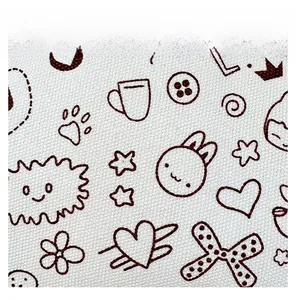 Close-up of white canvas fabric with brown cartoon rabbit and coffee cup prints