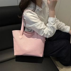Pink woven texture tote bag for women featuring a spacious trapezoid design for daily use