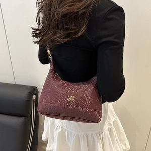 Chic burgundy snake skin pattern shoulder bag with elegant gold metal logo hardware