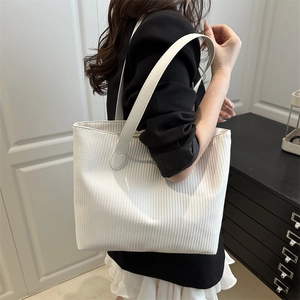 Minimalist white woven tote bag with large capacity and shoulder straps for women