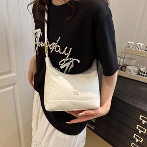 White snakeskin textured crescent shoulder bag with golden metallic logo and slim strap