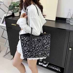 Large graffiti canvas tote bag with black leather handles and street style print