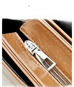 Macro detail of high-quality smooth metal zipper and lychee pattern leather texture