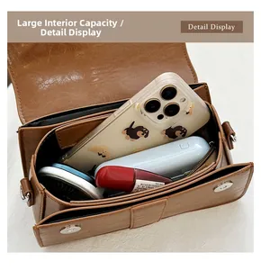 Detail view of large interior capacity of the retro brown crocodile pattern square bag